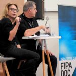 Sur la scène du FIPADOC 2026, Christopher Baldelli, président de T18, et Caroline Cochaux, directrice des programmes et des contenu